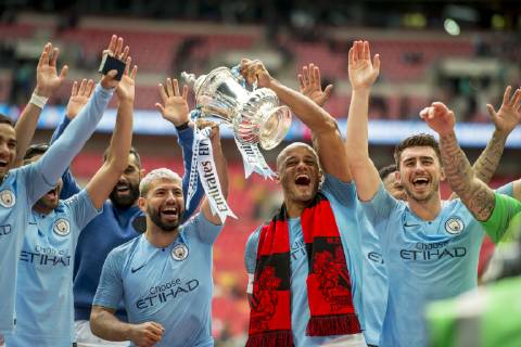 Vincent Kompany of Manchester City and his team mates lift the FA Trophy during The FA Cup Final match between Manchester City and Watford at Wembley Stadium, London, England on 18 May 2019. Copyright: xSalvioxCalabresex 24040059