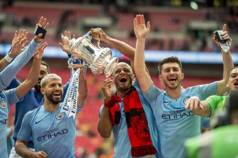 Vincent Kompany of Manchester City and his team mates lift the FA Trophy during The FA Cup Final match between Manchester City and Watford at Wembley Stadium, London, England on 18 May 2019. Copyright: xSalvioxCalabresex 24040060