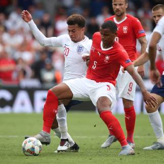 Switzerland v England UEFA Nations League 3rd Place Play-off Dele Alli of England and Manuel Akanji of Switzerland in action during the UEFA Nations League 3rd Place Play-off match at Estadio D. Afonso Henrique, Guimaraes Content Not Available For UK Newspapers Copyright: xPaulxChestertonx FIL-13338-0024