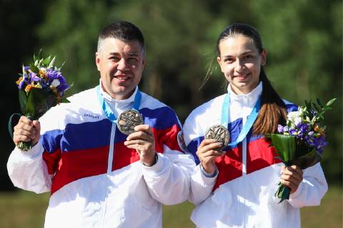 MINSK, BELARUS â€“ JUNE 24, 2019: Athletes Alexei Alipov (L) and Daria Semyanova of Russia celebrate winning bronze medals at a victory ceremony following the mixed trap shooting event at the Minsk 2019 Europaspiele Sergei Bobylev TASS  TS0B0BEC