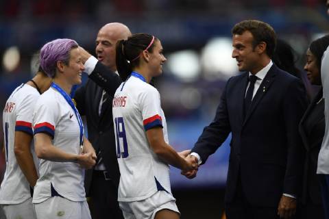 July 7, 2019 - Lyon, France - Emmanuel Macron, Head of State France whit Alex Morgan and Megan Rapinoe of United States after the 2019 FIFA Women s World Cup France Final match between The United State of America and The Netherlands at Stade de Lyon on July 7, 2019 in Lyon, France. United States of America v Netherlands : Final - 2019 FIFA Women s World Cup France  - ZUMAn230 20190707_zaa_n230_373 Copyright: xJosexBretonx