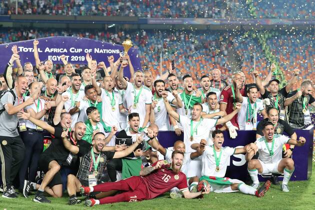 (190720) -- CAIRO, July 20, 2019 -- Team Algeria celebrate during the awarding ceremony after the 2019 Africa Cup of Nations final match between Senegal and Algeria in Cairo, Egypt on July 19, 2019. Algeria won 1-0 and claimed the title. ) (SP)EGYPT-CAIRO-SOCCER-AFRICA CUP OF NATIONS-FINAL-SENEGAL VS ALGERIA WangxTeng