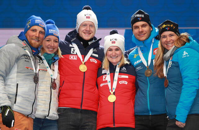 BIATHLON - IBU World Championships Antholz 2020 ANTHOLZ,ITALY,20.FEB.20 - BIATHLON - IBU World Championships 2020, single mixed relay. Image shows the rejoicing of Erik Lesser, Franziska Preuss (GER), Johannes Thingnes Boe, Marte Olsbu Roeiseland (NOR), Emilien Jacquelin and Anais Bescond (FRA). Keywords: medal. GEPAxpictures xAndreasxPranter