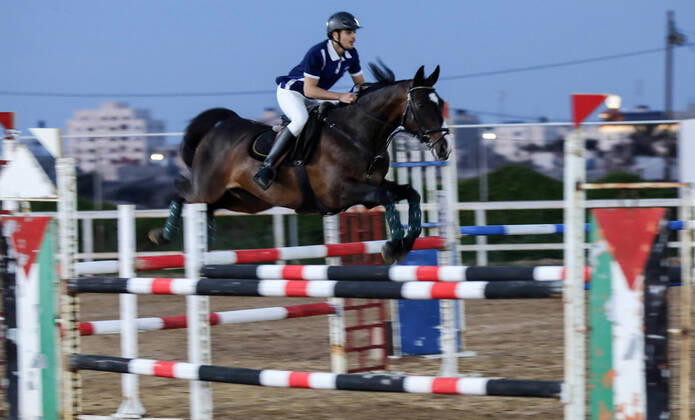 February 27, 2020, Gaza City, Gaza Strip, Palestinian Territory: A Palestinian horse rider on his horse jumps over a barrier during the first championship in jump barriers for the year 2020, on February 27, 2020 Middle East News - February 27, 2020 - ZUMAap3_ 97337261st Copyright: xMahmoudxAjjourx