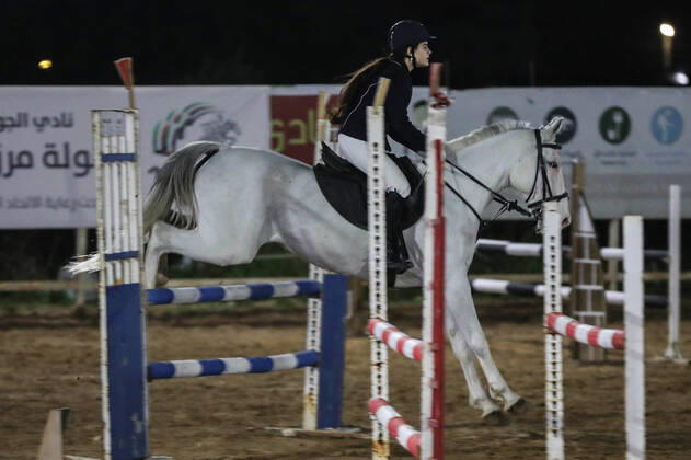February 27, 2020, Gaza City, Gaza Strip, Palestinian Territory: A Palestinian horse rider on his horse jumps over a barrier during the first championship in jump barriers for the year 2020, on February 27, 2020 Middle East News - February 27, 2020 - ZUMAap3_ 97337264st Copyright: xMahmoudxAjjourx