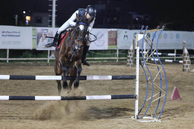 February 27, 2020, Gaza City, Gaza Strip, Palestinian Territory: A Palestinian horse rider on his horse jumps over a barrier during the first championship in jump barriers for the year 2020, on February 27, 2020 Middle East News - February 27, 2020 - ZUMAap3_ 97337373st Copyright: xMahmoudxAjjourx