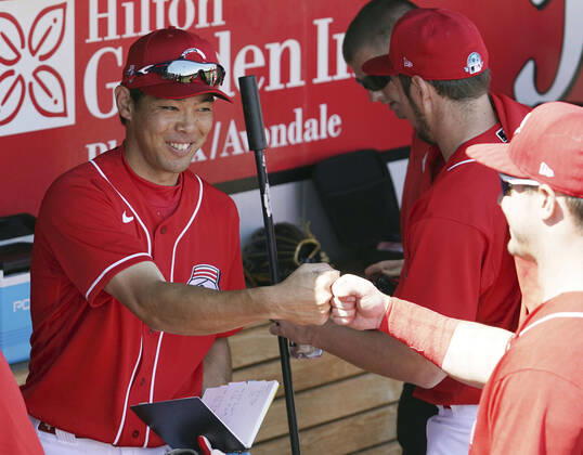MLB, Baseball Herren, USA spring training Shogo Akiyama of the Cincinnati Reds bumps fists with a teammate before a spring training game against the Los Angeles Angels on March 8, 2020, in Goodyear, Arizona.