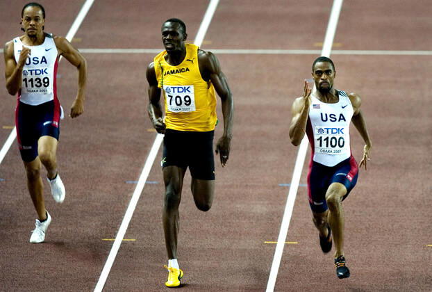 070830 Athletics, World Athletics Championships: Gold medalist Tyson Gay of USA wins 200 m before silver medalist Usain Bolt of Jamaica and bronze medalist Wallace Spearmon of USA at The World Athletics Championships on August 30, 2007 in Osaka, Japan. BILDBYRAN Copyright: EMILxMALMBORG BB070830EM038