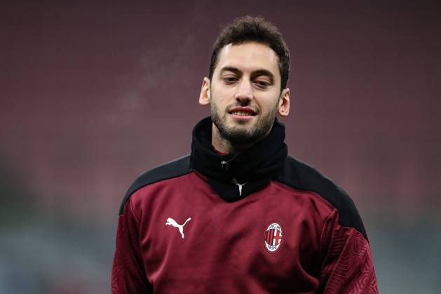 Hakan Calhanoglu of AC Milan during the warm up prior to the Coppa Italia match at Giuseppe Meazza, Milan. Picture date: 12th January 2021. Picture credit should read: Jonathan Moscrop Sportimage EDITORIAL USE ONLY. No use with unauthorised audio, video, data, fixture lists, club league logos or live services. Online in-match use limited to 120 images, no video emulation. No use in betting, games or single club league player publications. SPI-0842-0078