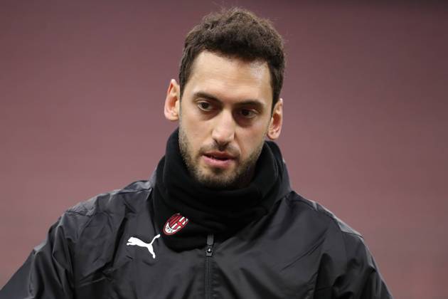 Hakan Calhanoglu of AC Milan during the warm up prior to the Serie A match at Giuseppe Meazza, Milan. Picture date: 7th February 2021. Picture credit should read: Jonathan Moscrop Sportimage EDITORIAL USE ONLY. No use with unauthorised audio, video, data, fixture lists, club league logos or live services. Online in-match use limited to 120 images, no video emulation. No use in betting, games or single club league player publications. SPI-0895-0083