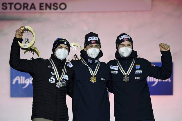 Ilkka Herola of Finland (L), winner Jarl Magnus Riiber (C) and third placed Jens Luraas Oftebro of Norway celebrate on the podium of the men s 10km individual Gundersen Nordic Combined medal ceremony event at the FIS Nordic Ski World Championships in Oberstdorf, Germany, on February 27, 2021. Oberstdorf Germany LKFTJK20210227204321CSJN  Copyright: xEmmixKorhonenx