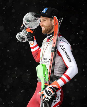 ALPINE SKIING - FIS WC Final Lenzerheide LENZERHEIDE,SWITZERLAND,21.MAR.21- ALPINE SKIING - FIS World Cup Final, slalom, men. Image shows Marco Schwarz (AUT). Keywords: crystal globe, medal. GEPAxpictures xHaraldxSteiner