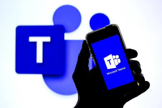 April 20, 2021, Barcelona, Catalonia, Spain: In this photo illustration a Microsoft Teams app seen displayed on a smartphone with the Microsoft Teams logo in the background. Barcelona Spain - ZUMAd159 20210420_zia_d159_107 Copyright: xThiagoxPrudenciox