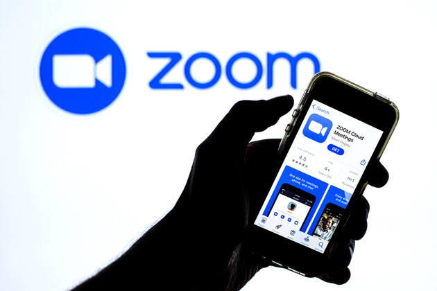 April 20, 2021, Barcelona, Catalonia, Spain: In this photo illustration a Zoom app in App Store seen displayed on a smartphone with the Zoom logo in the background. Barcelona Spain - ZUMAd159 20210420_zia_d159_115 Copyright: xThiagoxPrudenciox