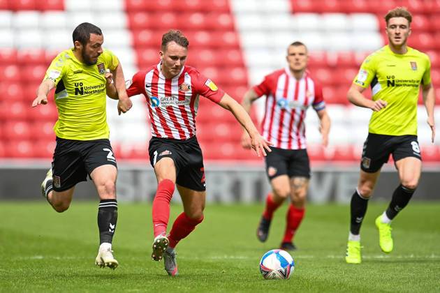 Sunderland v Northampton Town EFL Sky Bet League 1 09 05 2021. Michael Harriman ( 2) of Northampton Town FC pulls back Jack Diamond ( 21) of Sunderland AFC during the EFL Sky Bet League 1 match between Sunderland AFC and Northampton Town at the Stadium Of Light, Sunderland, England on 9 May 2021. Editorial use only DataCo restrictions apply See www.football-dataco.com , Copyright: xMalcolmxMackenziex PSI-12732-0007