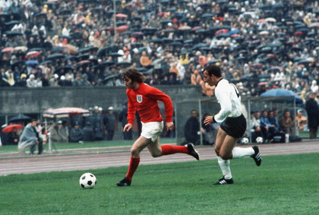 Football - 1972 UEFA European Football Championship Qualifying - Quarter Final Second Leg: West Germany 0 England 0 England s Rodney Marsh and West Germany s Horst-Dieter Hoettges in the Olympiastadion, West Berlin. Germany won the tie by an aggregate score of 3-1.