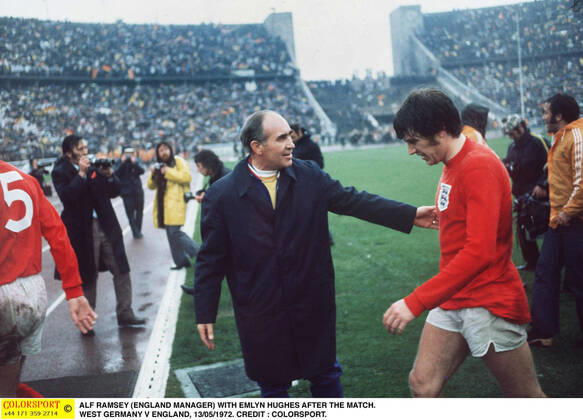 Football - 1972 UEFA European Football Championship Qualifying - Quarter Final Second Leg: West Germany 0 England 0 England manager Alf Ramsey consoles Emlyn Hughes as he leaves the field at the end of the game in the Olympiastadion, West Berlin. Germany won the tie by an aggregate score of 3-1.