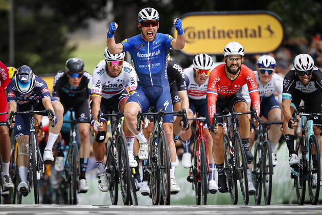 British Mark Cavendish of Deceuninck - Quick-Step (C) celebrates as he wins, before French Nacer Bouhanni of Team Arkea Samsic (CR) and Belgian Jasper Philipsen of Alpecin-Fenix (L) the sprint at the finish of the third stage of the 108th edition of the Tour de France cycling race, 182,9km from Lorient to Pontivy, France, Monday 28 June 2021. This year s Tour de France takes place from 26 June to 18 July 2021. PETExGODING x3022903x