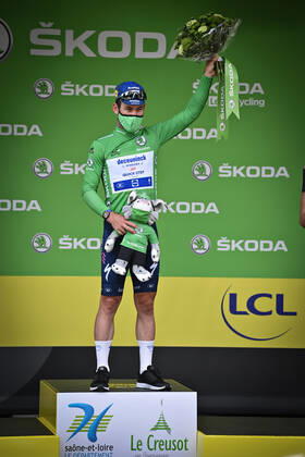 British Mark Cavendish of Deceuninck - Quick-Step celebrates on the podium in the green jersey of leader in the sprint ranking after the seventh stage of the 108th edition of the Tour de France cycling race, 249,1km from Vierzon to Le Creusot, France, Friday 02 July 2021. This year s Tour de France takes place from 26 June to 18 July 2021. DAVIDxSTOCKMAN x3025551x