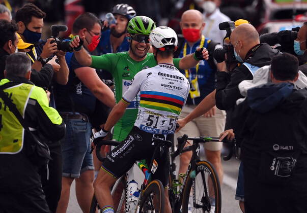 British Mark Cavendish of Deceuninck - Quick-Step and French Julian Alaphilippe of Deceuninck - Quick-Step celebrate after winning stage 10 of the 108th edition of the Tour de France cycling race, 190,7 km from Albertville to Valence, France, Tuesday 06 July 2021. This year s Tour de France takes place from 26 June to 18 July 2021. PETExGODING x3028174x