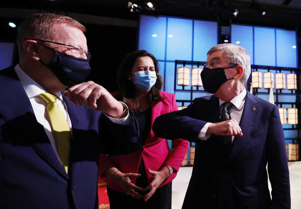 (210721) -- TOKYO, July 21, 2021 -- International Olympic Committee Thomas Bach (R) bumps elbows with members of the Brisbane 2032 delegation John Coates AC (L), President, Australian Olympic Committee and The Honourable Annastacia Palaszczuk MP, Premier of Queensland and Minister for Trade, after Brisbane was announced as the 2032 Summer Olympics host city during the 138th International Olympic Committee (IOC) Session in Tokyo, Japan, on July 21, 2021. ( Pool via Xinhua) (SP)TOKYO-JAPAN-IOC-138TH SESSION ToruxHanai 