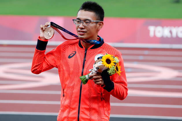 Men s 20km race walk bronze medalist Toshikazu Yamanishi of Japan holds up his medal during the medal ceremony at Olympic Stadium at the 2020 Summer Olympics in Tokyo, Japan on Friday, August 6, 2021.  OLY20210806402 TasosxKatopodis