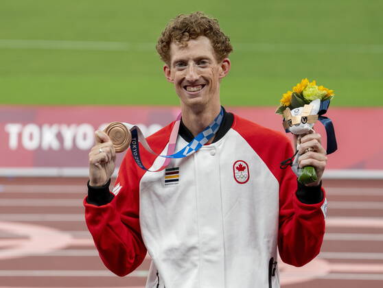 August 7, 2021, Tokyo, Japan: Evan Dunfee of Canada shows off his bronze medal for the menÃ¢â‚¬â ¢s 50km race walk at the Tokyo Olympics in Tokyo, Japan on Saturday August 7, 2021. Canada News - August 7, 2021  - ZUMAc35_ 20210807_zaf_c35_033 Copyright: xFrankxGunnx