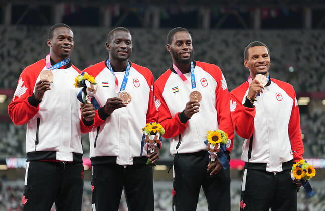 (210807) -- TOKYO, Aug. 7, 2021 -- Team members of Canada react during the awarding ceremony of the Men s 4x100m Relay at the Tokyo 2020 Olympic Games, Olympische Spiele, Olympia, OS in Tokyo, Japan, Aug. 7, 2021. ) (TOKYO2020)JAPAN-TOKYO-OLY-ATHLETICS-MEN S 4x100M RELAY-AWARDING CEREMONY LuixSiuxWai 