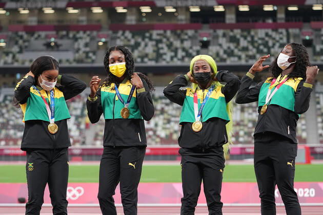 (210807) -- TOKYO, Aug. 7, 2021 -- Team members of Jamaica react during the awarding ceremony of the Women s 4x100m Relay at the Tokyo 2020 Olympic Games, Olympische Spiele, Olympia, OS in Tokyo, Japan, Aug. 7, 2021. ) (TOKYO2020)JAPAN-TOKYO-OLY-ATHLETICS-WOMEN S 4x100M RELAY-AWARDING CEREMONY LuixSiuxWai 