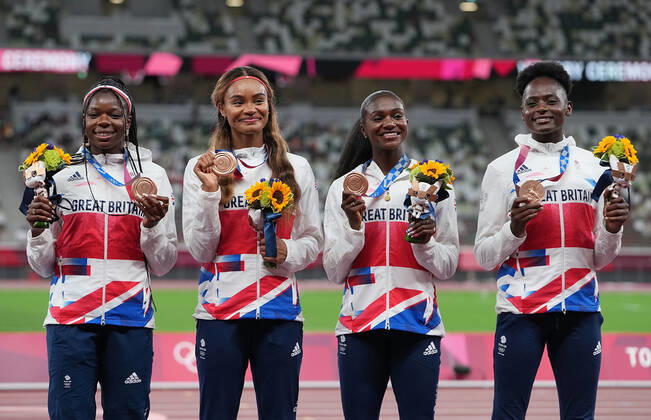 (210807) -- TOKYO, Aug. 7, 2021 -- Team members of Jamaica react during the awarding ceremony of the Women s 4x100m Relay at the Tokyo 2020 Olympic Games, Olympische Spiele, Olympia, OS in Tokyo, Japan, Aug. 7, 2021. ) (TOKYO2020)JAPAN-TOKYO-OLY-ATHLETICS-WOMEN S 4x100M RELAY-AWARDING CEREMONY LuixSiuxWai 