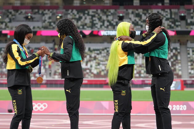 (210807) -- TOKYO, Aug. 7, 2021 -- Team members of Jamaica react during the awarding ceremony of the Women s 4x100m Relay at the Tokyo 2020 Olympic Games, Olympische Spiele, Olympia, OS in Tokyo, Japan, Aug. 7, 2021. ) (TOKYO2020)JAPAN-TOKYO-OLY-ATHLETICS-WOMEN S 4x100M RELAY-AWARDING CEREMONY LuixSiuxWai 