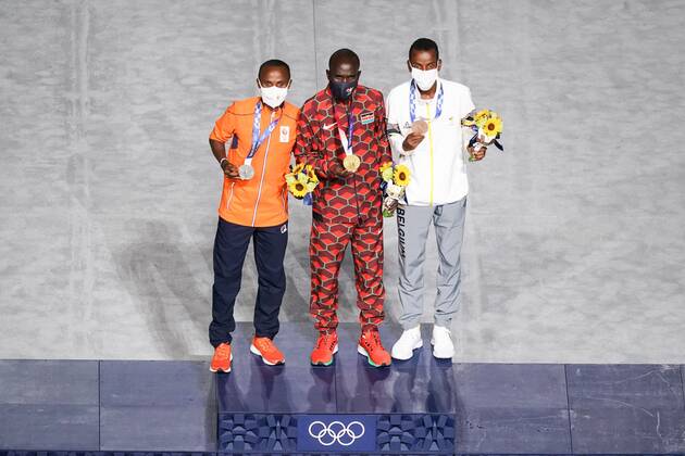 Mandatory Credit: Photo by Daniela Porcelli SPP Shutterstock (12253585v) Gold medalist Eliud Kipchoge (Kenya) middle), silver medalist Abdi Nageeye (Netherlands, left) and bronze medalist Bashir Abdi (Belgium) celebrates his medal during the Tokyo Olympics 2020 closing ceremony at the Olympic Stadium in Tokyo, Japan. Closing ceremony - Tokyo Olympics 2020 - Olympic Stadium Tokyo, Japan, August 8th 2021:, Toyko, Japan - 08 Aug 2021 Closing ceremony - Tokyo Olympics 2020 - Olympic Stadium Tokyo, Japan, August 8th 2021:, Toyko, Japan - 08 Aug 2021  Copyright: xDanielaxPorcelli SPP Shutterstockx 12253585v