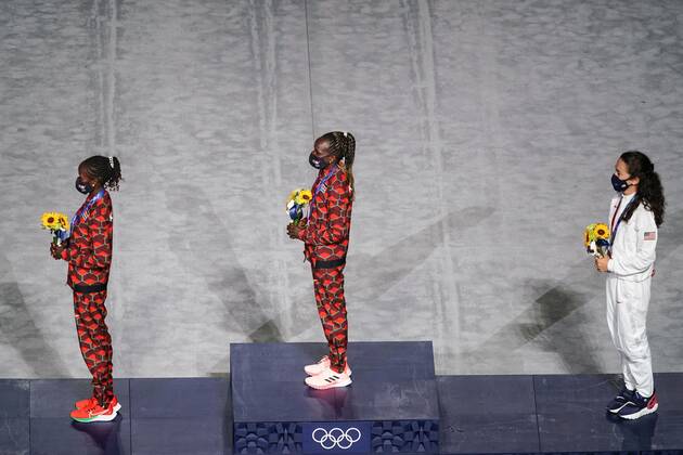 Mandatory Credit: Photo by Daniela Porcelli SPP Shutterstock (12253585n) Gold medalist Peres Jepchirchir (Kenya, middle), silver medalist Brigid Kosgei (Kenya, left) and bronze medalist Molly Seidel (USA) during their medal ceremony during the Tokyo Olympics 2020 closing ceremony at the Olympic Stadium in Tokyo, Japan. Closing ceremony - Tokyo Olympics 2020 - Olympic Stadium Tokyo, Japan, August 8th 2021:, Toyko, Japan - 08 Aug 2021 Closing ceremony - Tokyo Olympics 2020 - Olympic Stadium Tokyo, Japan, August 8th 2021:, Toyko, Japan - 08 Aug 2021  Copyright: xDanielaxPorcelli SPP Shutterstockx 12253585n