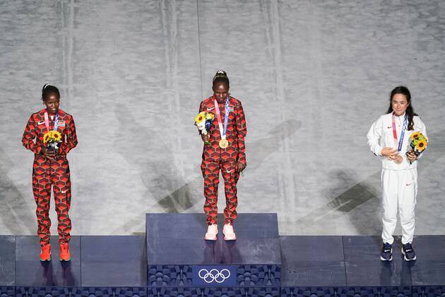 Mandatory Credit: Photo by Daniela Porcelli SPP Shutterstock (12253585o) Gold medalist Peres Jepchirchir (Kenya, middle), silver medalist Brigid Kosgei (Kenya, left) and bronze medalist Molly Seidel (USA) during their medal ceremony during the Tokyo Olympics 2020 closing ceremony at the Olympic Stadium in Tokyo, Japan. Closing ceremony - Tokyo Olympics 2020 - Olympic Stadium Tokyo, Japan, August 8th 2021:, Toyko, Japan - 08 Aug 2021 Closing ceremony - Tokyo Olympics 2020 - Olympic Stadium Tokyo, Japan, August 8th 2021:, Toyko, Japan - 08 Aug 2021  Copyright: xDanielaxPorcelli SPP Shutterstockx 12253585o