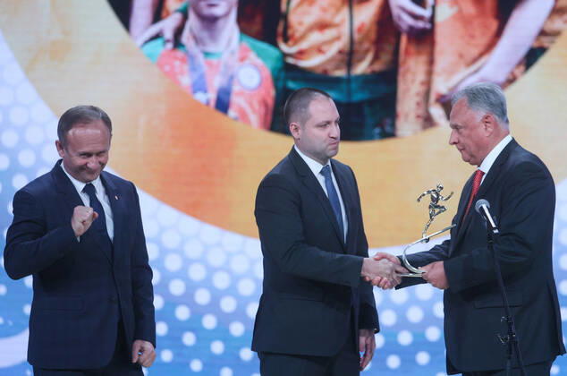 MOSCOW, RUSSIA - DECEMBER 8, 2021: Kemerovo Region Minister Sergei Myaus and Deputy Governor Sergei Alekseyev (L-R) accept the 2021 Russian National Sports Award for Best Region from Alexei Kulakovsky, Deputy Head of the Russian Presidential Directorate for Supporting State Council Activities, during a ceremony at Irina Viner-Usmanova Gymnastics Palace. Established in 2010 and coming with a million-rouble prize, the award is given to athletes, coaches, journalists and regional government officials who contributed to the promotion of Russian sports. Gavriil Grigorov TASS  0144161229st