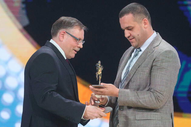 MOSCOW, RUSSIA - DECEMBER 8, 2021: Russian State University of Physical Education and professor Sergei Levushkin (L) accepts his 2021 Russian National Sports Award for Service to Sports from AIBA (International Boxing Association) President Umar Kremlev during a ceremony at Irina Viner-Usmanova Gymnastics Palace. Established in 2010 and coming with a million-rouble prize, the award is given to athletes, coaches, journalists and regional government officials who contributed to the promotion of Russian sports. Gavriil Grigorov TASS  0144163902st