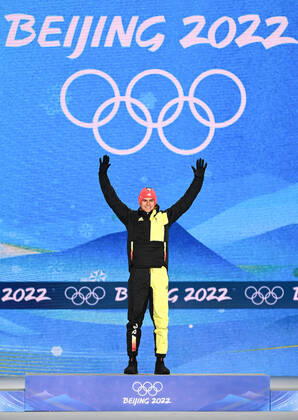 (220210) -- ZHANGJIAKOU, Feb. 10, 2022 -- Gold medalist Vinzenz Geiger of Germany reacts during the awarding ceremony of Nordic Combined Individual Gundersen Normal Hill 10km at Zhangjiakou Medals Plaza of the Winter Olympics in Zhangjiakou, north China s Hebei Province, Feb. 10, 2022. ) (BEIJING2022)CHINA- ZHANGJIAKOU-OLYMPIC Winter games, Winterspiele,Spiele, Summer games AWARDING CEREMONY (CN) FengxKaihua 