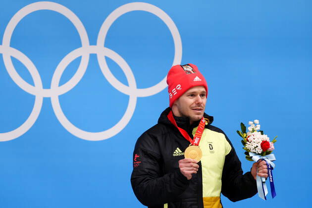 BEIJING, CHINA - FEBRUARY 11, 2022: Gold medalist, Christopher Grotheer of Germany attends an award ceremony for the men s skeleton event at the 2022 Winter Olympics at the Yanqing National Sliding Centre. Anton Novoderezhkin TASS  TS12287B