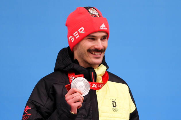 BEIJING, CHINA - FEBRUARY 11, 2022: Silver medalist, Axel Jungk of Germany poses for a photograph during an award ceremony for the men s skeleton event at the 2022 Winter Olympics at the Yanqing National Sliding Centre. Anton Novoderezhkin TASS  TS1228A2