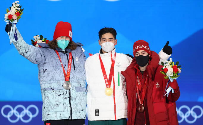 BEIJING, CHINA - FEBRUARY 14, 2022: Silver medalist, ROC athlete Konstantin Ivliyev, Gold medalist, Shaoang Liu of Hungary and Bronze medalist, Steven Dubois (L-R) of Canada attend an award ceremony for the men s 500m short track Speed skating, Eisschnelllauf event at the 2022 Winter Olympic Games, Olympische Spiele, Olympia, OS at the Medal Plaza. Anton Novoderezhkin TASS TS12316C