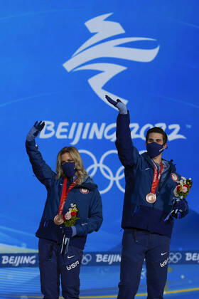Bronze medallists Zachary Donohue and Madison Hubbell of the United States wave during the medals ceremony for the Figure skating, Eiskunstlauf Ice Dance competition at the Beijing 2022 Winter Olympics on Monday, February 14, 2022.  OLY20220214315 PaulxHanna