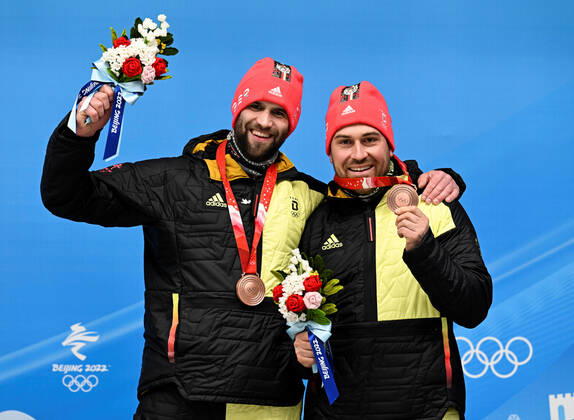 (220215) -- BEIJING, Feb. 15, 2022 -- Bronze medalists Christoph Hafer Matthias Sommer of Germany celebrate after the bobsleigh 2-man heat of Beijing 2022 Winter Olympics at National Sliding Centre in Yanqing District, Beijing, capital of China, Feb. 15, 2022. ) (BEIJING2022)CHINA-BEIJING-OLYMPIC Winter games, Winterspiele,Spiele, Summer games BOBSLEIGH-2-MEN-HEAT(CN) HexChangshan 