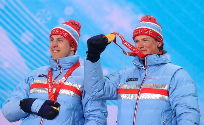 ZHANGJIAKOU, CHINA - FEBRUARY 17, 2022: Gold medal winners Erik Valnes (L) and Johannes Hoesflot Klaebo of Norway are seen during the victory ceremony for the men s cross-country skiing team sprint classic, at the Medal Plaza, at the 2022 Winter Olympic Games, Olympische Spiele, Olympia, OS Stanislav Krasilnikov TASS  TS123D13