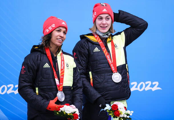 BEIJING, CHINA - FEBRUARY 19, 2022: Silver medalists Mariama Jamanka (L) and Alexandra Burghardt of Germany at a flower ceremony for the 2-woman bobsleigh at the 2022 Winter Olympic Games, Olympische Spiele, Olympia, OS at the Yanqing National Sliding Centre. Anton Novoderezhkin TASS  TS124670