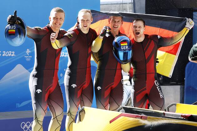 Beijing Olympics: Bobsleigh Germany s Francesco Friedrich, Thorsten Margis, Candy Bauer and Alexander Schueller celebrate after winning the four-man bobsleigh competition at the Beijing Winter Olympics on Feb. 20, 2022, at the National Sliding Centre in the Yanqing competition zone.  A14AA0001254042P