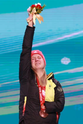 (220311) -- BEIJING, March 11, 2022 -- Bronze medalist Andrea Rothfuss of Germany reacts during the awarding ceremony for the Para Alpine Skiing Women s Giant Slalom Standing of Beijing 2022 Paralympic Winter games, Winterspiele,Spiele, Summer games at Yanqing Medals Plaza in Yanqing District, Beijing, capital of China, March 11, 2022. ) (SP)CHINA-BEIJING-WINTER PARALYMPICS-PARA ALPINE SKIING-WOMEN S GIANT SLALOM-AWARDING CEREMONY(CN) LuoxYuan 