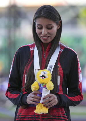 (220716) -- EUGENE, July 16, 2022 -- Gold medalist Kimberly Garcia Leon of Peru reacts during the awarding ceremony of women s 20km race walk at the World Athletics Championships Oregon22 in Eugene, Oregon, the United States, July 15, 2022. ) (SP)U.S.-EUGENE-ATHLETICS-WORLD CHAMPIONSHIPS-WOMEN S 20KM RACE WALK-AWARDING CEREMONY WangxYing 