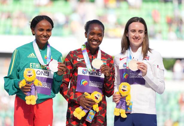 (220720) -- EUGENE, July 20, 2022 -- Gold medalist Kenya s Faith Kipyegon (C) celebrates with silver medalist Gudaf Tsegay (L) of Ethiopia and bronze medalist Britain s Laura Muir during the awarding ceremony for women s 1500m at the World Athletics Championships Oregon22 in Eugene, Oregon, the United States, July 19, 2022. ) (SP)U.S.-EUGENE-ATHLETICS-WORLD CHAMPIONSHIPS-WOMEN S 1500M AWARDING CEREMONY WuxXiaoling 