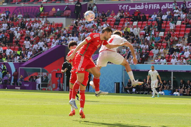 Wales v Iran 2022 FIFA World Cup, WM, Weltmeisterschaft, Fussball Ben Davies of Wales in an aerial challenge with Ali Gholizadeh of Iran during the 2022 FIFA World Cup Group B match at Ahmad Bin Ali Stadium, Al-Rayyan Content Not Available For UK Newspapers Copyright: xPaulxChestertonx FIL-17643-0032 UK Newspapers OUT