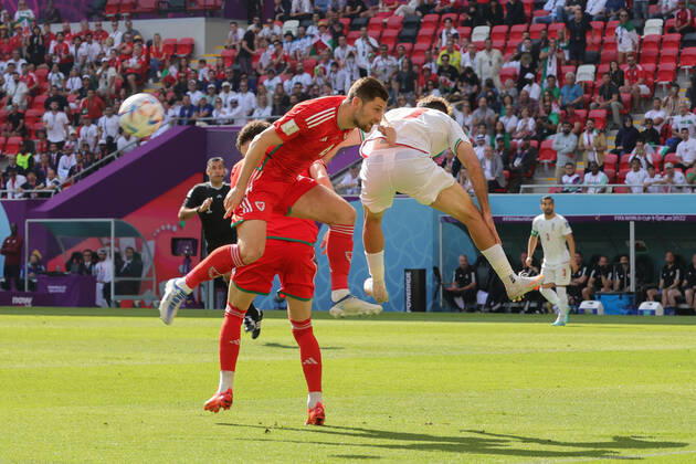 Wales v Iran 2022 FIFA World Cup, WM, Weltmeisterschaft, Fussball Ben Davies of Wales in an aerial challenge with Ali Gholizadeh of Iran during the 2022 FIFA World Cup Group B match at Ahmad Bin Ali Stadium, Al-Rayyan Content Not Available For UK Newspapers Copyright: xPaulxChestertonx FIL-17643-0033 UK Newspapers OUT